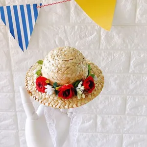 Miniature woven straw pet hat featuring red roses, lace straps, and Christmas reindeer antlers