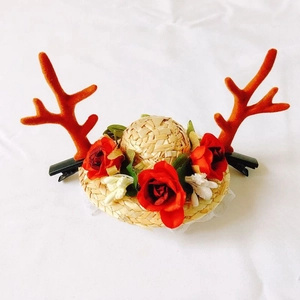 Christmas pet straw hat with red reindeer antlers and flower accents for cats and dogs
