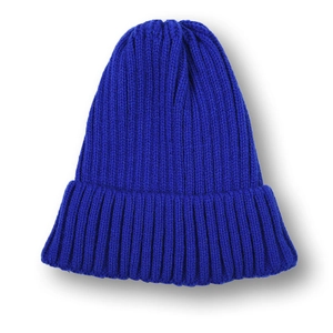 Detailed close-up of navy blue ribbed knit beanie with thick vertical texture and cuff
