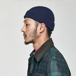 Classic navy blue ribbed knit beanie hat for men in minimalist solid color style