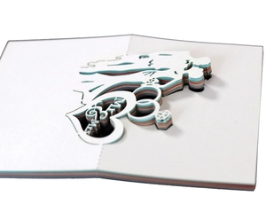 Detail of 3D laser-cut wedding card featuring bride, groom, and Mr & Mrs text