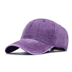 Macro detail of purple washed cotton fabric and six-panel stitching on baseball cap