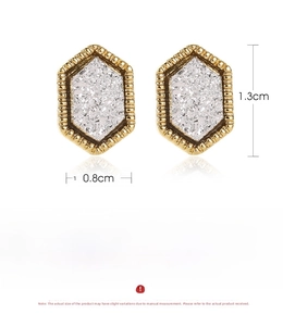 Detail of copper hexagon studs with druzy stone inlay showing 1.3cm x 0.8cm dimensions