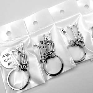 Father's Day keychains with hammer, wrench, and screwdriver tool charms in a gift set