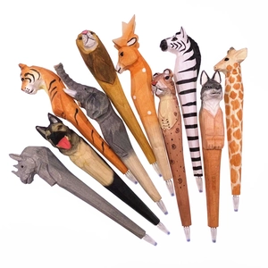 Detailed close-up of hand-carved wooden pens featuring various colorful animal heads
