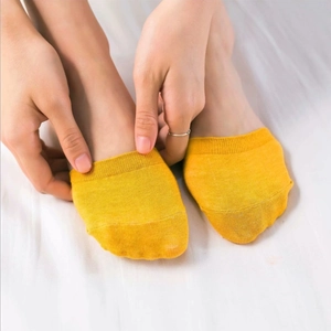 Yellow cotton invisible socks for women shown on feet in a high-quality close-up view