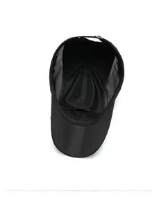 Detail of internal breathable mesh structure and adjustable strap on black baseball cap