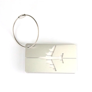 Detailed view of airplane hollow aluminum luggage tag with steel wire loop and ID card