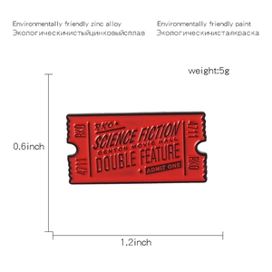 Detailed view of red retro movie ticket enamel pin with dimensions and weight info