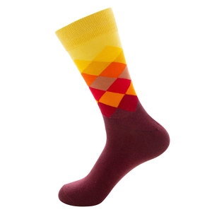 Close-up of vibrant argyle knit pattern and ribbed cuff on a cotton blend crew sock