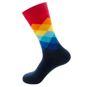 Detailed close-up of rainbow geometric diamond pattern on navy blue crew socks