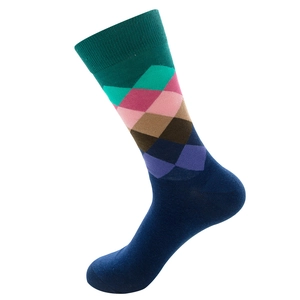 Close-up of colorful argyle pattern cotton blend crew socks with green ribbed cuff detail