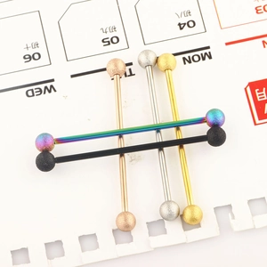 Industrial barbell body jewelry set in five colors with matte textured bead ends