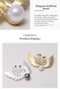 Detailed close-up of matte gold and silver swan brooches with elegant pearl accents