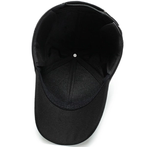 Internal view of black wool baseball cap with ear flaps and reinforced stitching