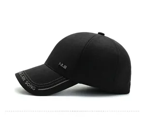 Detail of black winter baseball cap with metal NLS logo and MA LAN SONG embroidery