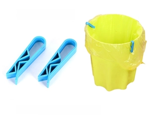 Detail of blue plastic trash bag clips showing non-slip grip on a garbage bin