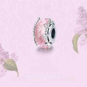 Close-up of S925 silver flower charm with pink faceted crystal stone for DIY jewelry