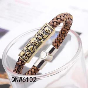 Bracciale punk vintage in pelle intrecciata marrone con teschio in bronzo e chiusura magnetica