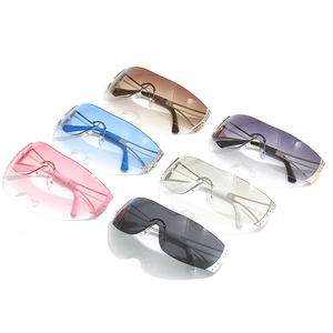 Frameless shield sunglasses with rhinestone accents in various gradient lens colors