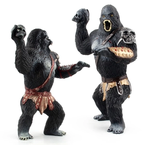 Solid gorilla figurines set with golden armor and skull accessories on white background