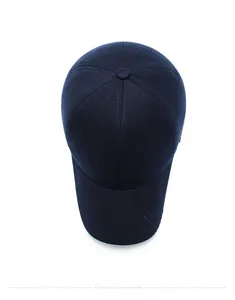 Top down view of navy blue winter baseball cap for men with warm wool fabric texture
