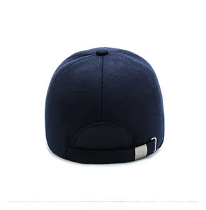 Detail view of the navy wool cap back featuring an adjustable metal buckle and stitching