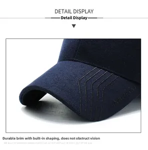 Macro shot of durable wool blend cap visor with reinforced stitching and curved edge