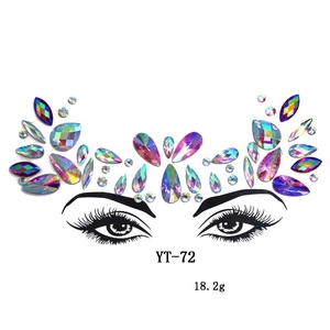 Detail of holographic AB facial rhinestones and eyelash decals for masquerade parties