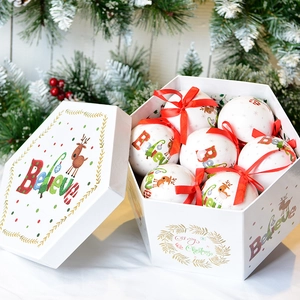 Christmas tree decoration set with white painted foam balls and red ribbons in a gift box