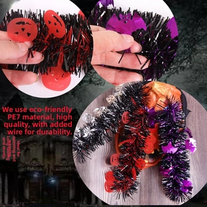 Detail of Halloween tinsel garland with red pumpkins, purple bats and PET wire texture