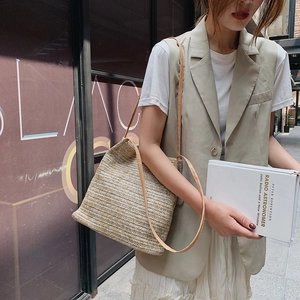 Fashionable handmade straw shoulder bag with khaki and cream weaving for beach holidays