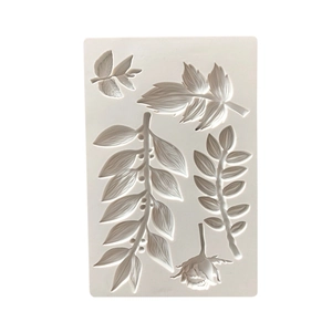 Detailed top view of a white silicone mold with floral and leaf patterns for DIY baking