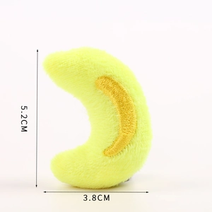 Detail of yellow plush moon accessory with gold embroidery, size 5.2cm x 3.8cm