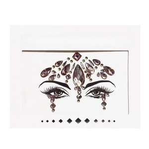 Macro view of smokey purple acrylic face crystal stickers for masquerade makeup