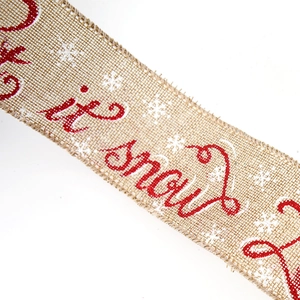 Gros plan de l'inscription Let it snow et flocon sur ruban de Noël en lin