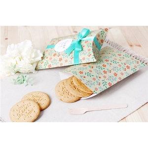 Floral pillow gift box with blue ribbon and Thank You tag on a rustic wooden table