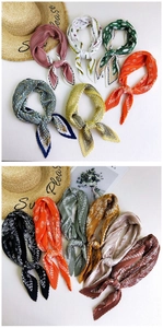 Detail of pleated silk scarves in various patterns and colors for women neck decoration