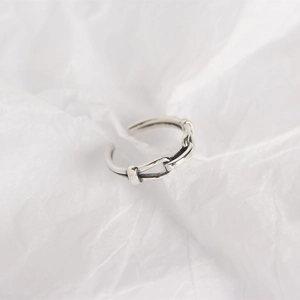 Macro shot of 925 sterling silver chain ring with minimalist open design and metallic luster