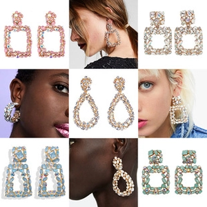 Collage of oversized geometric crystal earrings in pink blue and white for women