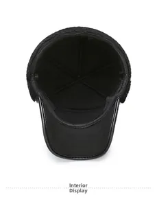 Detailed macro view of the warm black faux fur lining inside the winter baseball cap