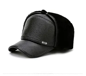 Close-up of winter faux leather trapper hat with black fur lining and metal Sport tag