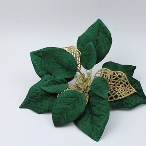 Close-up of 22cm Christmas flower with green velvet petals and golden glitter mesh details
