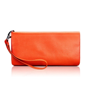 Close-up of orange pebble leather wallet featuring detachable wrist strap and silver metal clasp