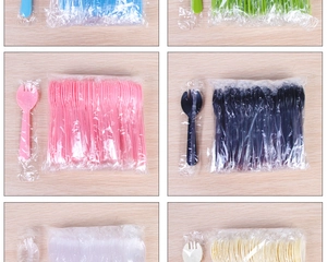 Detail view of colorful disposable plastic sporks individually wrapped for food hygiene