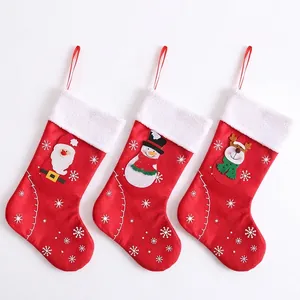 Three-piece Christmas stockings set with Santa, Snowman, and Reindeer felt applique patterns
