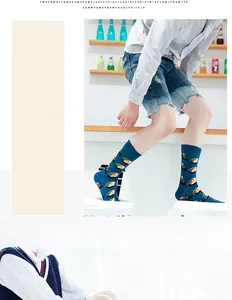 Detailed shot of trendy blue mid-tube socks featuring a creative oyster shell print