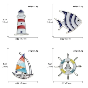 Set of 4 nautical enamel pins featuring lighthouse, fish, sailboat, and steering wheel