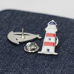 Minimalist red and blue enamel lighthouse brooch with silver metal butterfly clasp