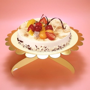 Single-tier gold paper cake stand with scalloped edges for birthday party decoration